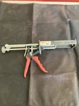 Duramix 4997 Two Part Epoxy Dispenser. Used. Price: $12.00.