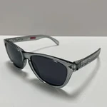 Oakley Frogskins OO9245 Polarized Sunglasses Gray Clear Frame Dark Lenses New. Price: $75.00.